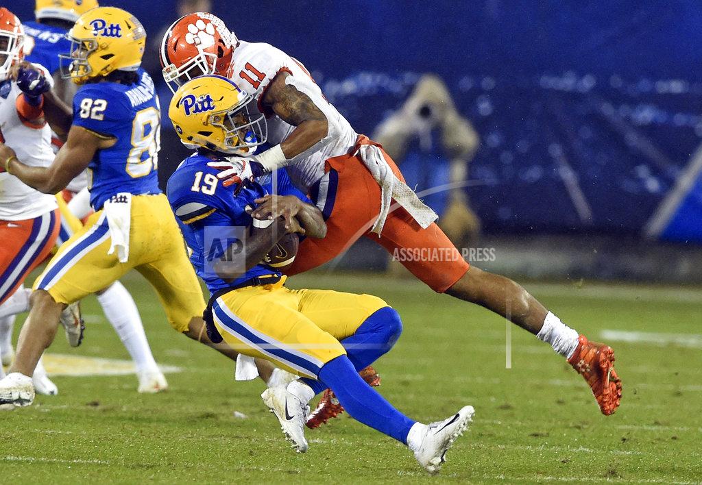 Mike Mccarn Pittsburgh's Jake Zilinskas (19) is tackled by Clemson's Isaiah Simmons (11) in the first half of the Atlantic Coast Conference championship NCAA college football game in Charlotte, N.C., Saturday, Dec. 1, 2018. (AP Photo/Mike McCarn)