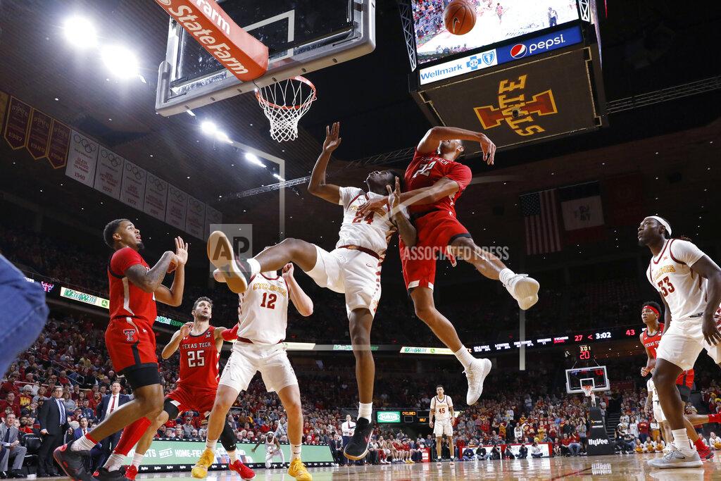 Charlie Neibergall Texas Tech forward TJ Holyfield (22) blocks a shot by Iowa State guard Terrence Lewis (24) during the first half of an NCAA college basketball game Saturday, Feb. 22, 2020, in Ames, Iowa. (AP Photo/Charlie Neibergall)