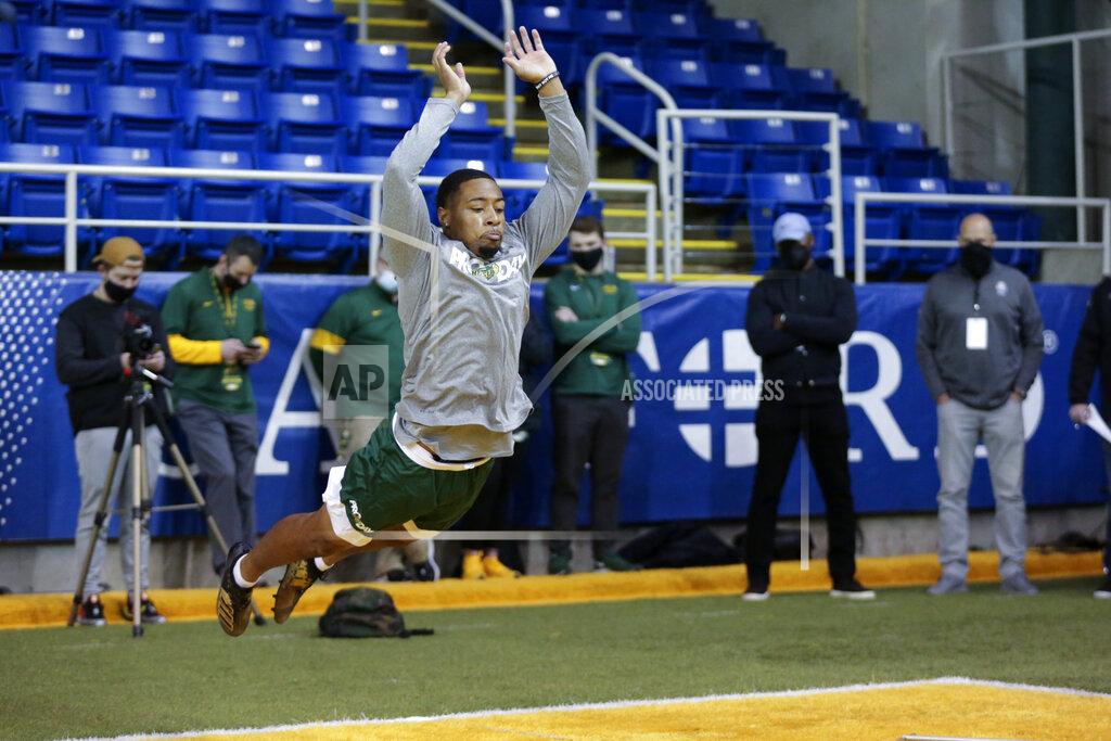 Andy Clayton-King North Dakota State cornerback Marquise Bridges long jumps at the school's football NFL Pro Day Friday, March, 12, 2021, in Fargo, North Dakota. (AP Photo/Andy Clayton- King)