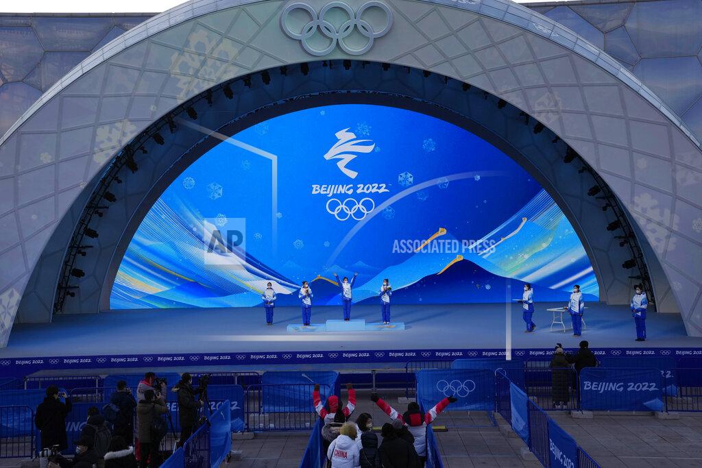 Ng Han Guan Staff members rehearse a victory ceremony at the Beijing Medals Plaza of the Winter Olympics in Beijing, China on Jan. 3, 2022. The Beijing Winter Olympics open in 30 days, and Norway is expected to head the medal table for the second straight time, even topping its record haul of 39 medals in 2018 in Pyeongchang, South Korea. This is the prediction of U.S.-based Gracenote Sports, which released its outlook on Wednesday, Jan. 5, 2022 with the Olympics opening on Feb. 4. (AP Photo/Ng Han Guan)