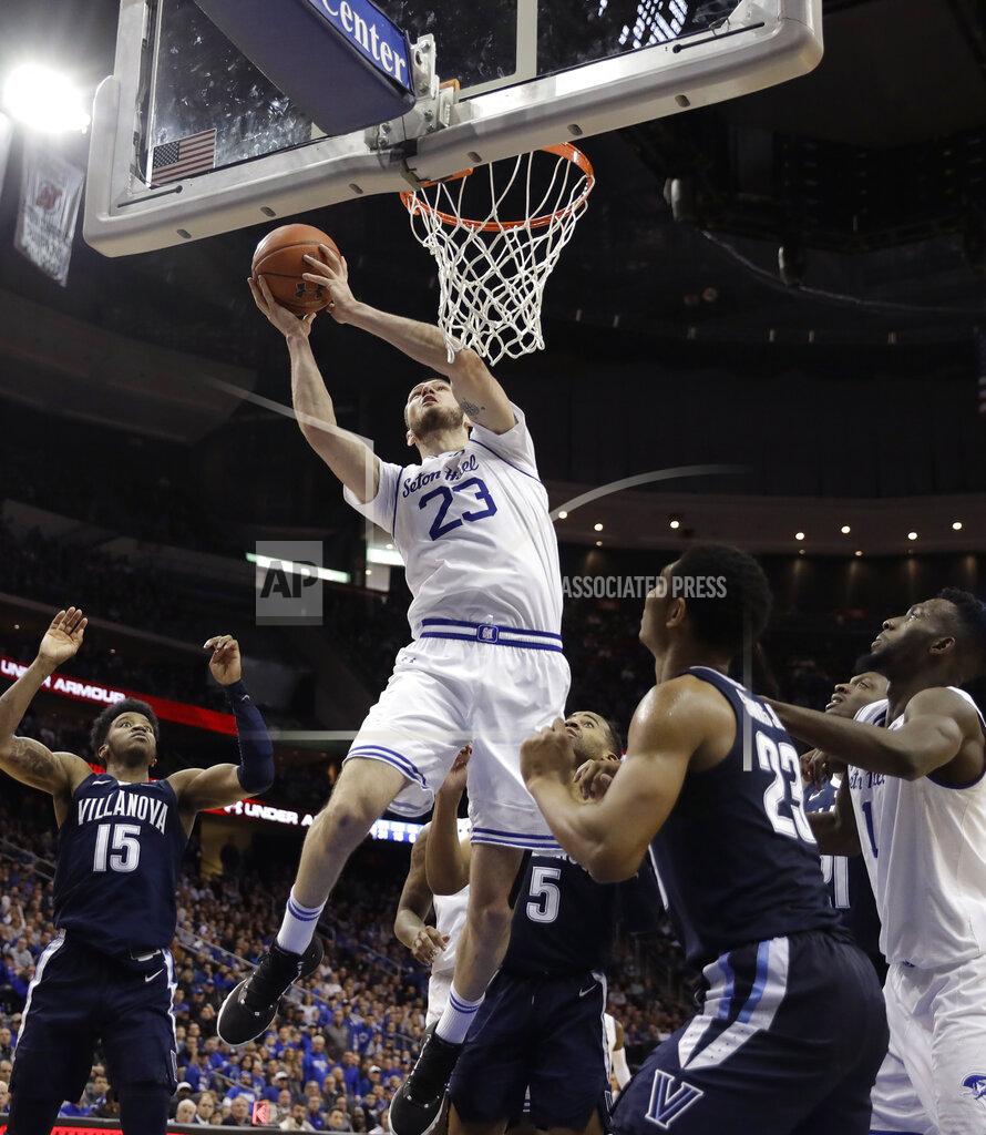 Kathy Willens Seton Hall forward Sandro Mamukelashvili (23) goes up for two points as Villanova forward Saddiq Bey (15), Villanova guard Phil Booth (5) and Villanova forward Jermaine Samuels (23) watch from the floor during the second half of an NCAA college basketball game, Saturday, March 9, 2019, in Newark, N.J. Seton Hall defeated Villanova 79-75. (AP Photo/Kathy Willens)