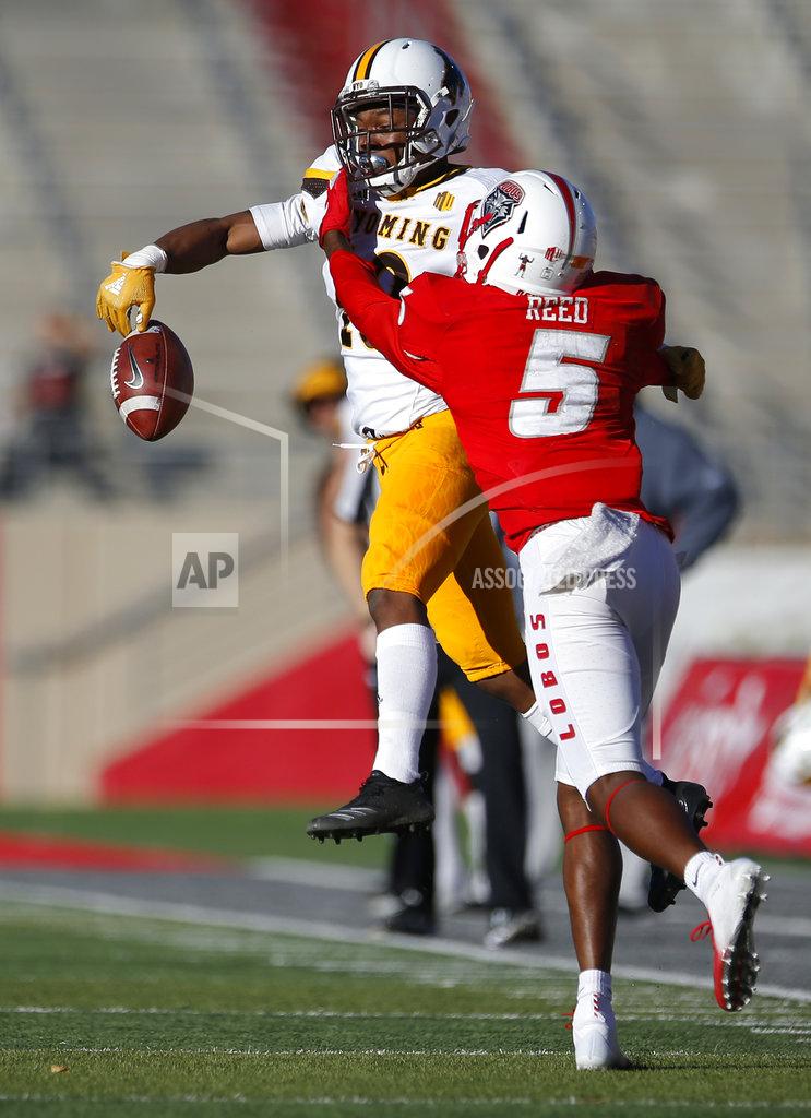 Andres Leighton Wyoming cornerback Keyon Blakenbaker (18) breaks up a pass intended for New Mexico wide receiver Patrick Reed (5) during the second half of an NCAA college football game in Albuquerque, N.M., Saturday, Nov. 24, 2018. Wyoming won 31-3. (AP Photo/Andres Leighton)
