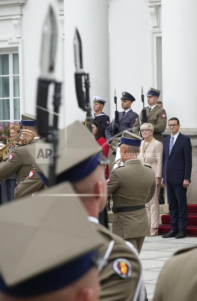 Czarek Sokolowski Lithuanian Prime Minister Ingrida Simonyte, second right, being greeted by Poland's Prime Minister Mateusz Morawiecki on a visit for talks that include the region's security in the face of migrant pressure on the two countries' borders with Belarus, in Warsaw, Poland, on Friday, Sept. 17, 2021. (AP Photo/Czarek Sokolowski)