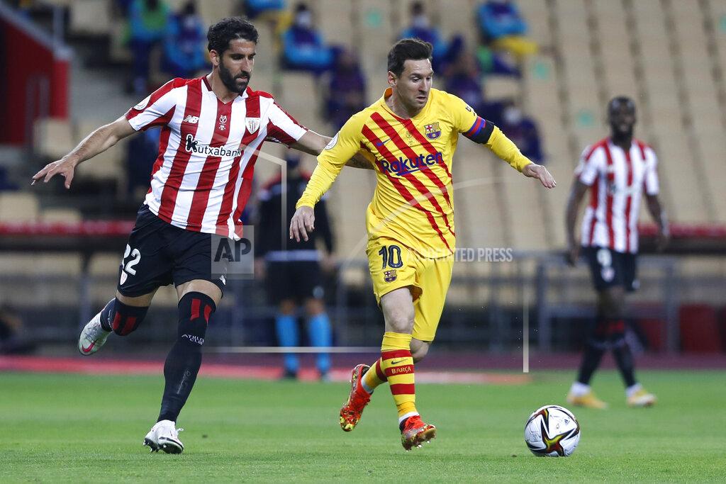 Angel Fernandez Barcelona's Lionel Messi fights for the ball against Athletic Bilbao's Raul Garcia during the Spanish Copa del Rey final 2021 between Athletic Bilbao and Barcelona at La Cartuja stadium in Seville, Spain, Saturday April 17, 2021. (AP Photo/Angel Fernandez)