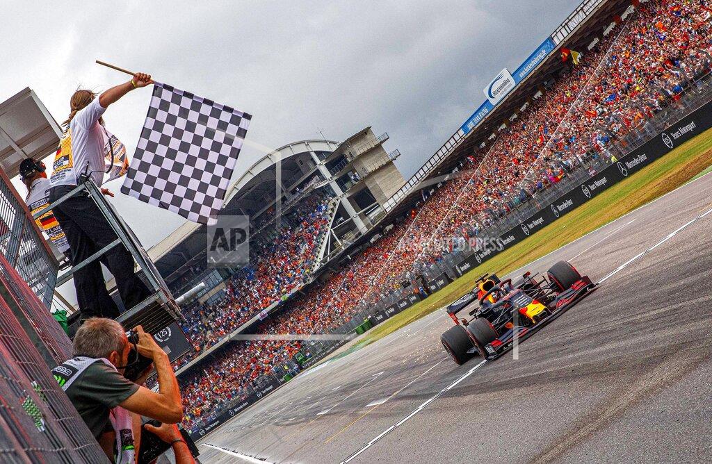Red Bull driver Max Verstappen of the Netherland's crosses the finish line to win the German Formula One Grand Prix at the Hockenheimring racetrack in Hockenheim, Germany, Sunday, July 28, 2019. (Epa pool photo Via AP/Suki Sulejmanovic)