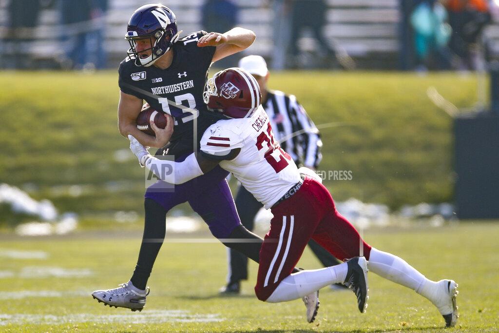 Jim Young Northwestern's Jason Whittaker, left, is tackled by Massachusetts' Claudin Cherrelus during the first half of an NCAA college football game Saturday, Nov. 16, 2019, in Evanston, Ill. (AP Photo/Jim Young)