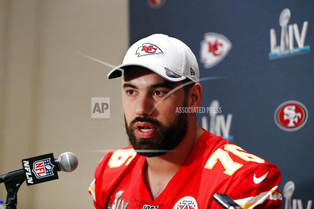 FILE - In this Wednesday, Jan. 29, 2020, file photo, Kansas City Chiefs offensive guard Laurent Duvernay-Tardif (76) speaks during a news conference in Aventura, Fla., for the NFL Super Bowl 54 football game. Duvernay-Tardif, of the Super Bowl champion Kansas City Chiefs, became the first player to opt out of the upcoming NFL season due to the coronavirus pandemic, Friday, July 24, 2020. (AP Photo/Brynn Anderson, File)
