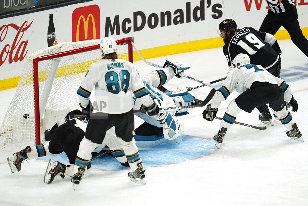 Ashley Landis Los Angeles Kings right wing Alex Iafallo (19) scores a goal during the third period of the team's NHL hockey game against the San Jose Sharks on Thursday, Feb. 11, 2021, in Los Angeles. (AP Photo/Ashley Landis)