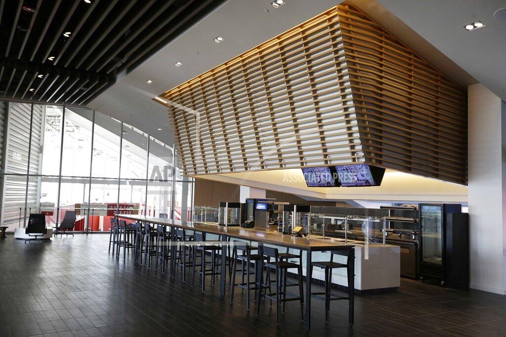 FILE - In this July 17, 2014, file photo, a food concession is shown inside the Levi's 501 Club on the opening day of Levi's Stadium in Santa Clara, Calif. It used to be that empty seats caused palpitations in team owners and college administrators relying on ticket sales and concessions to beef up the profit margins. Now, those empty seats – and short lines and clear concourses – will be the norm for a while as sports grapples with social distancing requirements. (AP Photo/Eric Risberg, File)
