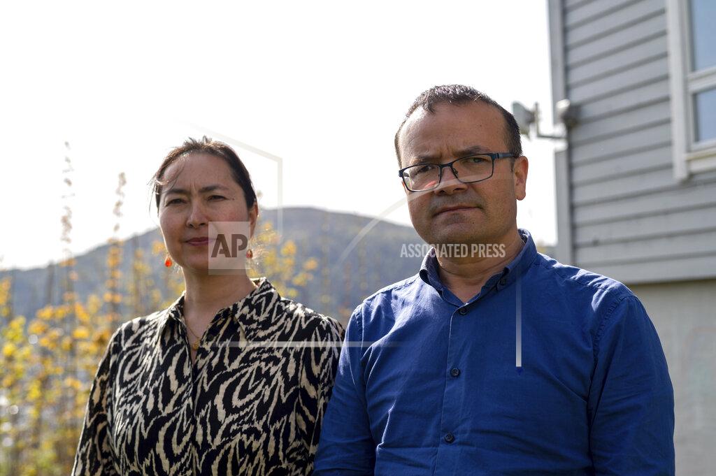 Paul Johannessen Uyghur couple Mihrigul Musa, left, and Abduweli Ayup pose for a photograph in their yard in Bergen, Norway on May 8, 2022. Nearly one in 25 people in a county in the Uyghur heartland of China has been sentenced to prison on terrorism-related charges, in what is the highest known imprisonment rate in the world, an Associated Press review of leaked data shows. Ayup and Musa knew friends and relatives sentenced to prison according to the list. (AP Photo/Paul Johannessen)