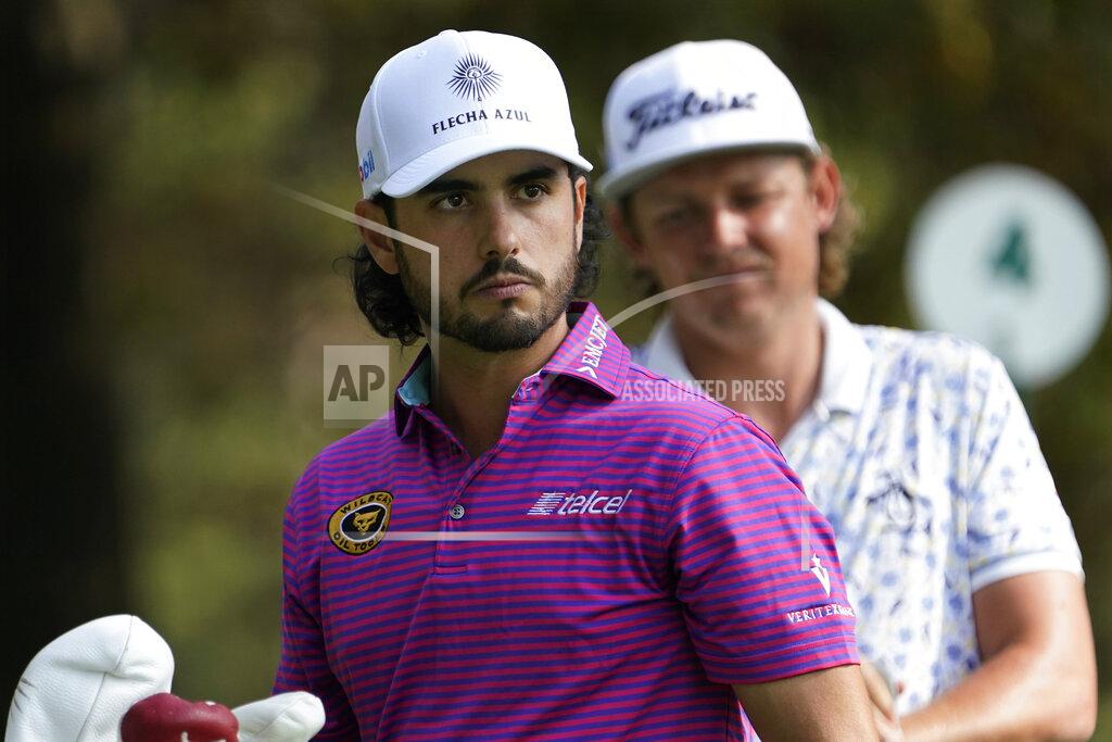 David J. Phillip Abraham Ancer, left, of Mexico, and Cameron Smith, of Australia, wait to tee off on the fourth hole during the third round of the Masters golf tournament Saturday, Nov. 14, 2020, in Augusta, Ga. (AP Photo/David J. Phillip)