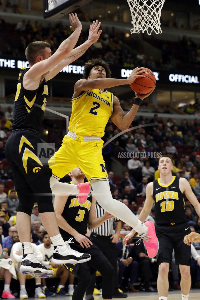 Nam Y. Huh Michigan's Jordan Poole (2) goes up to a basket against Iowa's Connor McCaffery during the second half of an NCAA college basketball game in the quarterfinals of the Big Ten Conference tournament, Friday, March 15, 2019, in Chicago. (AP Photo/Nam Y. Huh)