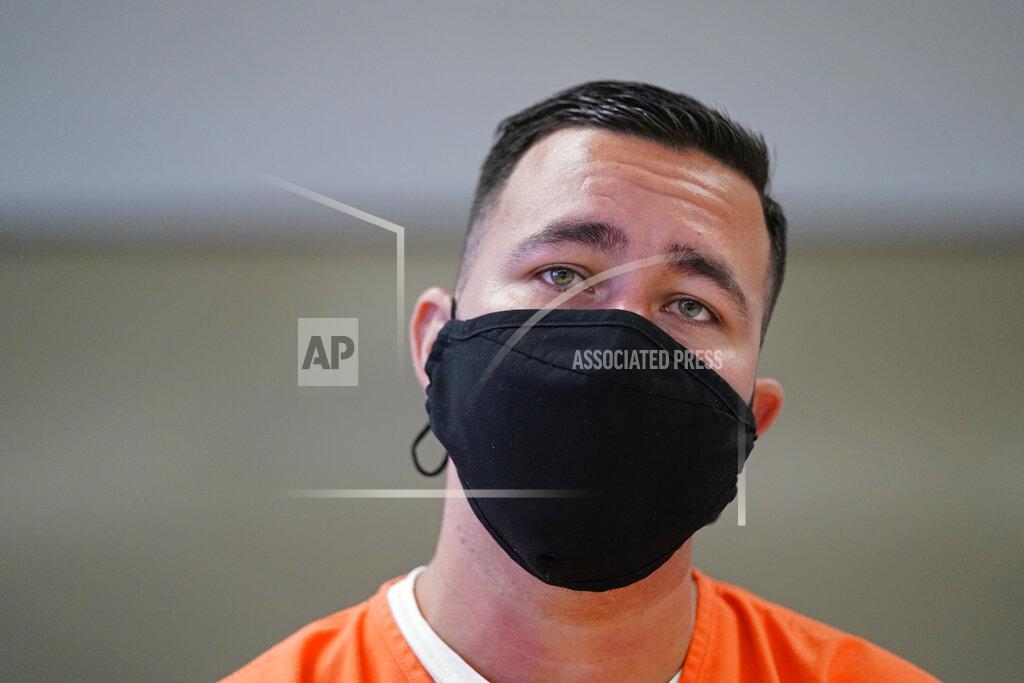 Gerald Herbert Immigration detainee Alexander Martinez speaks during an interview with The Associated Press inside the Winn Correctional Center in Winnfield, La., Friday, July 30, 2021. Since the end of February, the number of detainees has more than doubled, to nearly 27,000 as of July 22. (AP Photo/Gerald Herbert)