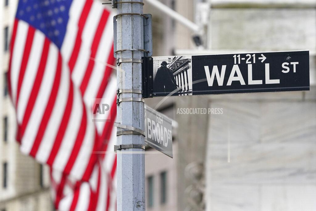 FILE - A street sign is displayed at the New York Stock Exchange in New York, Monday, Nov. 23, 2020. Stocks are opening higher on Wall Street, Wednesday, Feb. 10, 2021 as investors get back to buying a day after the S&P 500 ended a six-day winning streak. (AP Photo/Seth Wenig)