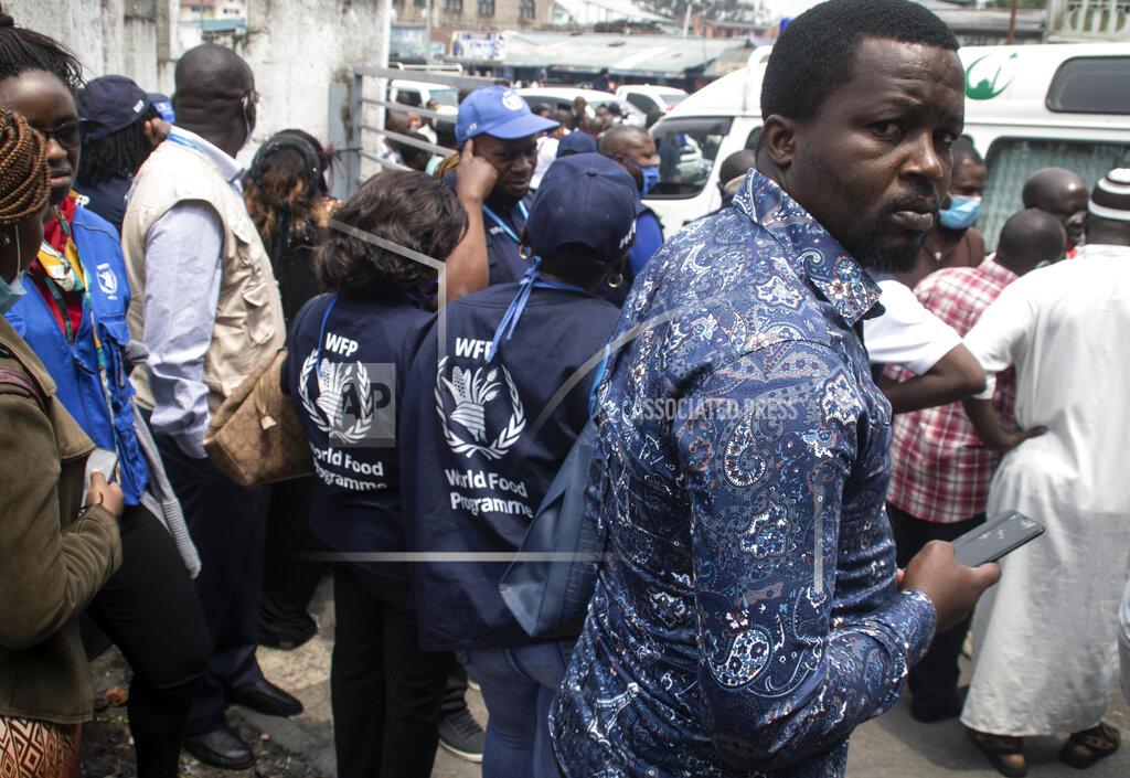 Justin Kabumba Colleagues of World Food Programme (WFP) driver Moustapha Milambo, who was killed in the attack on a U.N. convoy that also killed the Italian ambassador to Congo and an Italian Carabinieri police officer, wait to receive his body at the morgue in Goma, North Kivu province, Congo Tuesday, Feb. 23, 2021. An Italian Carabinieri unit is expected in Congo Tuesday to investigate the killings of the Italian ambassador to Congo, an Italian Carabinieri police officer and their driver in the country's east. (AP Photo/Justin Kabumba)