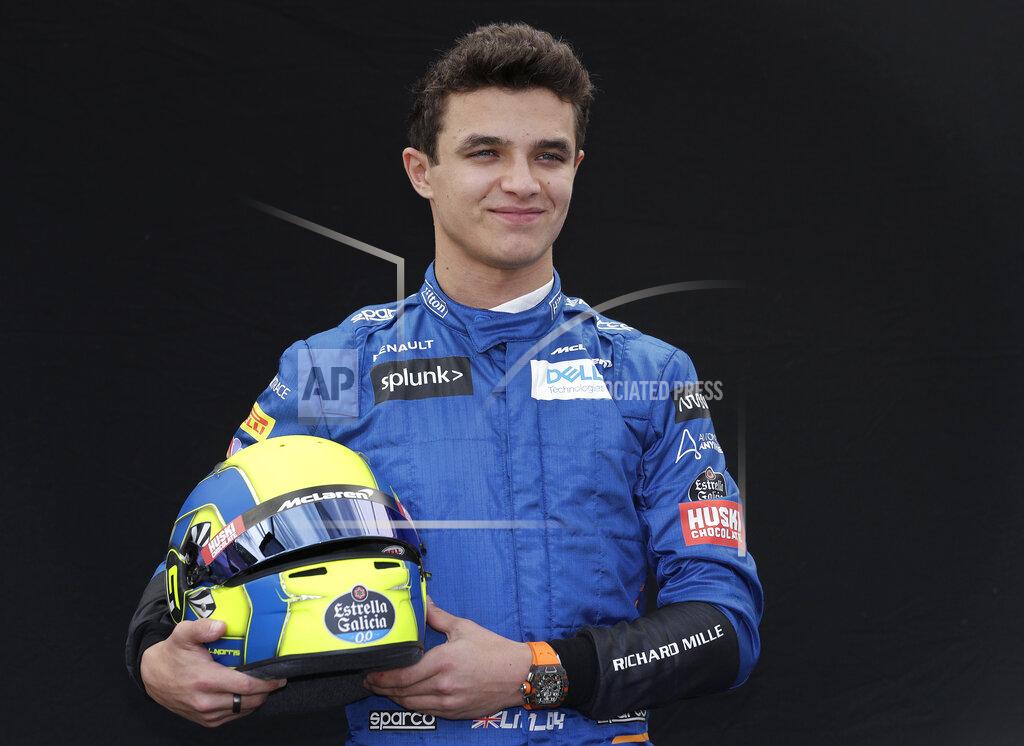 McLaren driver Lando Norris of Britain poses for a photo at the Australian Formula One Grand Prix in Melbourne, Thursday, March 12, 2020. (AP Photo/Rick Rycroft)