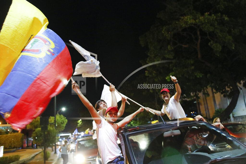 Angel Dejesus Supporters of Guillermo Lasso, candidate of Creating Opportunities party or CREO, celebrate in Guayaquil, Ecuador, Sunday, April 11, 2021. Lasso, a former banker, won a runoff presidential election beating economist Andres Arauz, an economist protege of former President Rafael Correa.(AP Photo/Angel Dejesus)