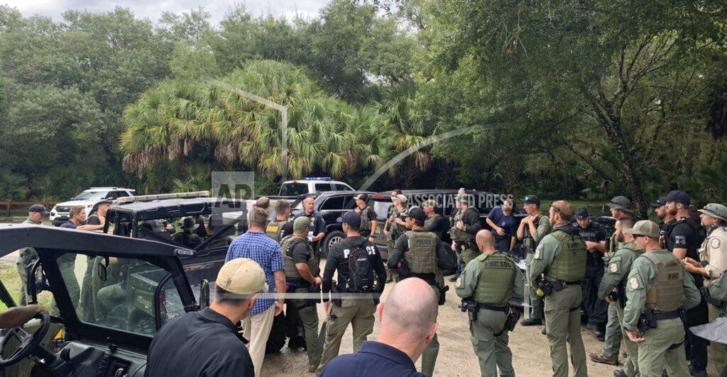 Uncredited This photo provided by North Port Police Department, law enforcement officials conduct a search of the vast Carlton Reserve in the Sarasota, Fla., area for Brian Laundrie on Saturday, Sept. 18, 2021. Laundrie is a person of interest in the disappearance of his girlfriend, Gabrielle “Gabby” Petito. (North Port Police Department via AP)