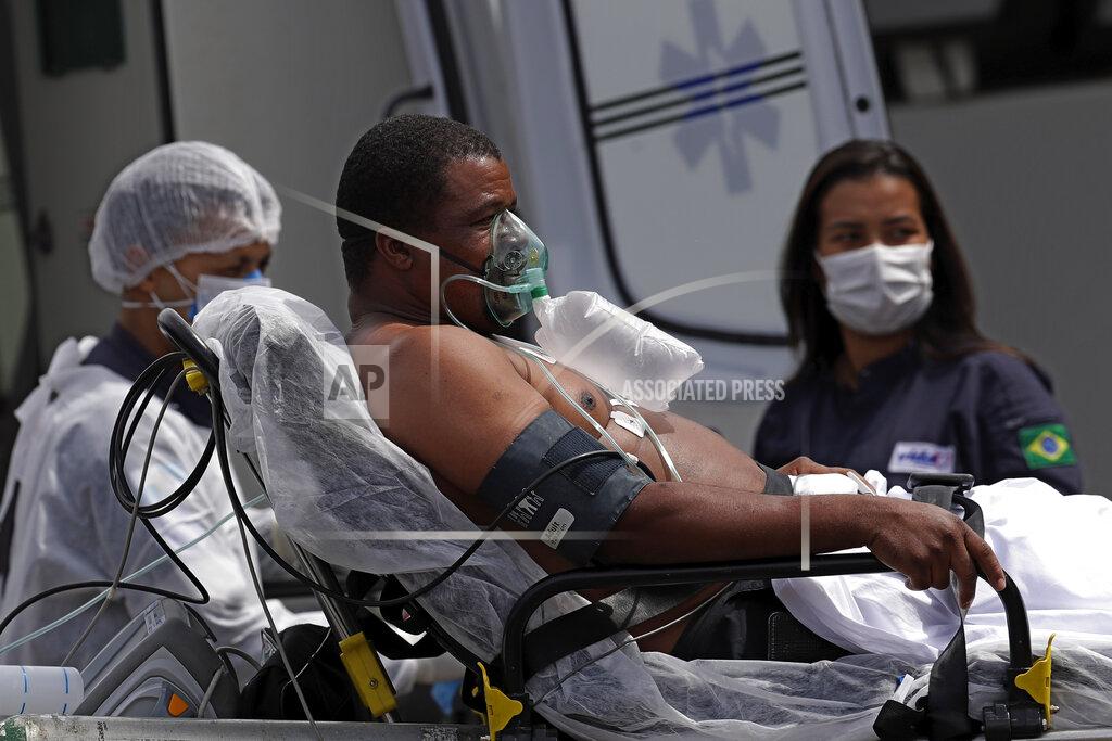 Eraldo Peres A 41-year-old patient suspected of having COVID-19 arrives from an ambulance to the HRAN public hospital in Brasilia, Brazil, Wednesday, April 14, 2021. (AP Photo/Eraldo Peres)