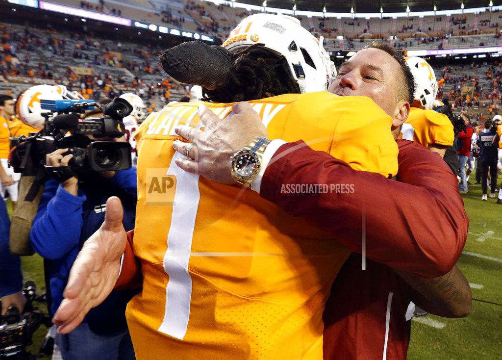 Wade Payne Former Tennessee head football coach Butch Jones hugs Tennessee wide receiver Marquez Callaway (1) after an NCAA college football game Saturday, Oct. 20, 2018, in Knoxville, Tenn. Alabama won 58-21. (AP Photo/Wade Payne)