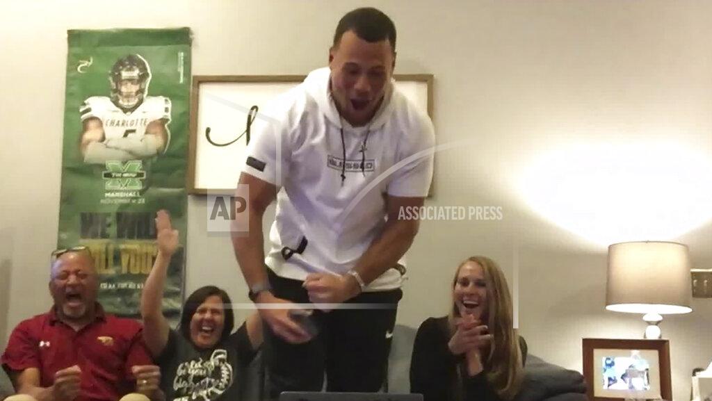 In this still image from video provided by the NFL, Alex Highsmith, center, reacts after being selected by the Pittsburgh Steelers during the third round of the NFL football draft, Friday, April 24, 2020. (NFL via AP)
