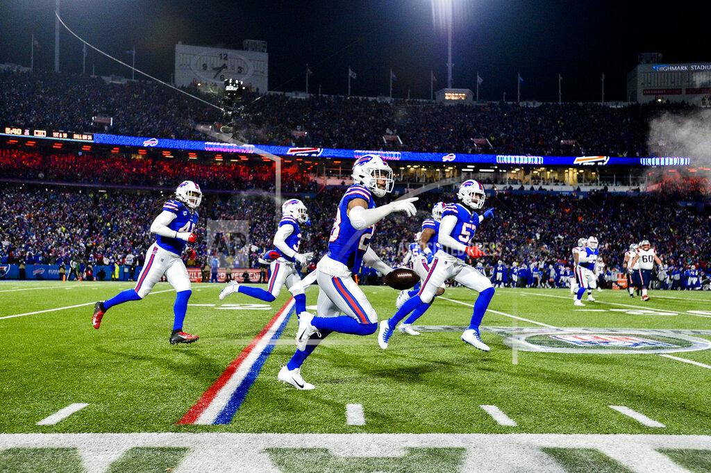 Adrian Kraus Buffalo Bills safety Micah Hyde, center, celebrates after catching an interception during the first half of an NFL wild-card playoff football game against the New England Patriots, Saturday, Jan. 15, 2022, in Orchard Park, N.Y. (AP Photo/Adrian Kraus)