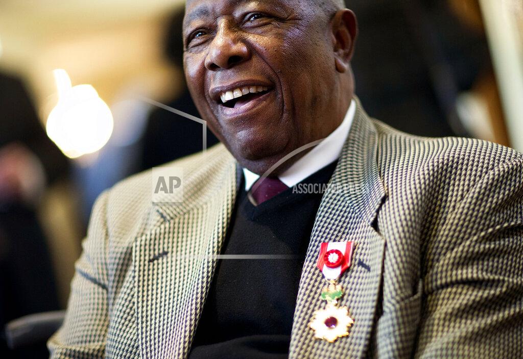 David Goldman Hank Aaron smiles after being presented with the Order of the Rising Sun, Gold Rays with Rosette by the Consul General of Japan at his official residence Thursday, Jan. 14, 2016, in Atlanta. Japan has honored the former home run king with one of its highest awards, bestowing the Order of the Rising Sun for bringing young people and countries together through baseball. (AP Photo/David Goldman)