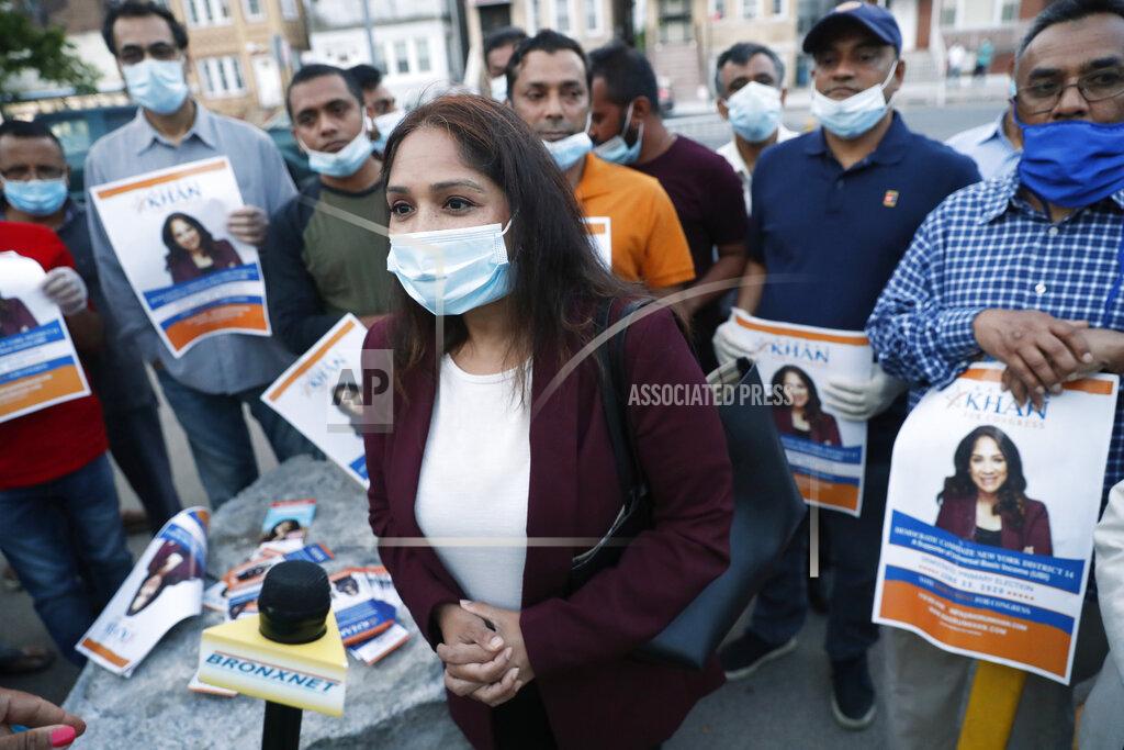 Kathy Willens Supporters surround Badrun Khan, center, in New York on Wednesday, June 17, 2020, as Khan was being interviewed after participating in a debate against U.S. Rep. Alexandria Ocasio-Cortez, D-New York, and Michelle Caruso-Cabrera ahead of New York's June 23 primary. (AP Photo/Kathy Willens)