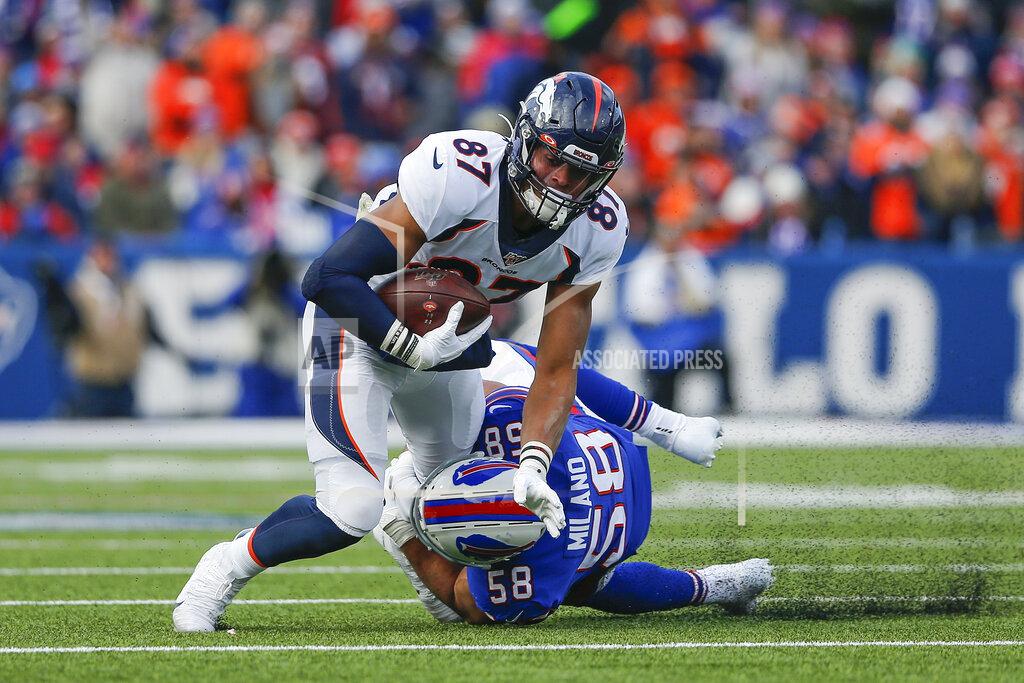 John Munson Denver Broncos tight end Noah Fant (87) is tackled by Buffalo Bills outside linebacker Matt Milano (58) during the second quarter of an NFL football game, Sunday, Nov. 24, 2019, in Orchard Park, N.Y. (AP Photo/John Munson)