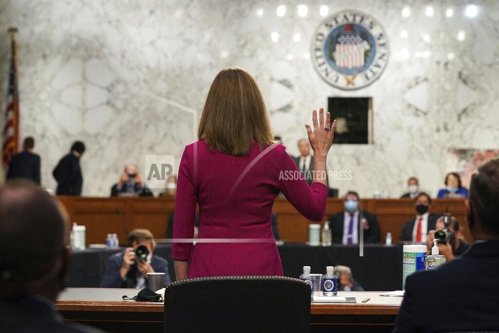 Greg Nash Supreme Court nominee Amy Coney Barrett is sworn in for her confirmation hearing before the Senate Judiciary Committee, Monday, Oct. 12, 2020, on Capitol Hill in Washington. (Greg Nash/Pool via AP)