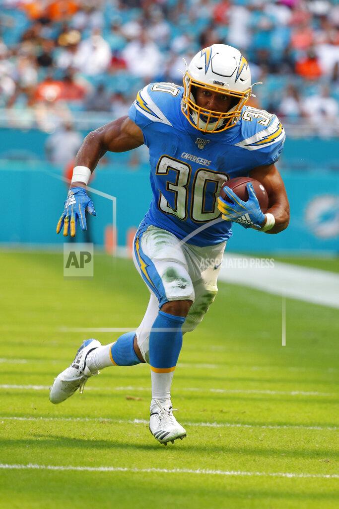 Wilfredo Lee Los Angeles Chargers running back Austin Ekeler (30) runs for a touchdown, during the first half at an NFL football game against the Miami Dolphins, Sunday, Sept. 29, 2019, in Miami Gardens, Fla. (AP Photo/Wilfredo Lee)