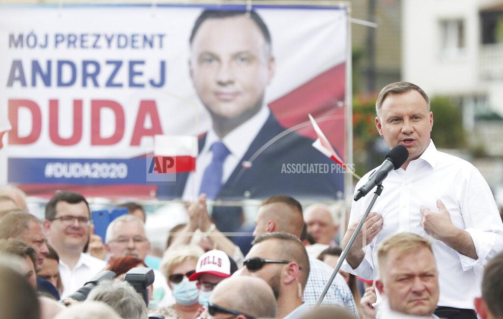 Czarek Sokolowski Polish President Andrzej Duda waves to supporters as he campaigns for a second term in Serock, Poland, on Wednesday, June 17, 2020.Duda is the frontrunner ahead of the election on Sunday, June 28, but is not expected to reach the 50 percent threshold needed to win outright. That will require a runoff two weeks later in which he is expected to face off against Warsaw Mayor Rafal Trzaskowski in a very close race.(AP Photo/Czarek Sokolowski)