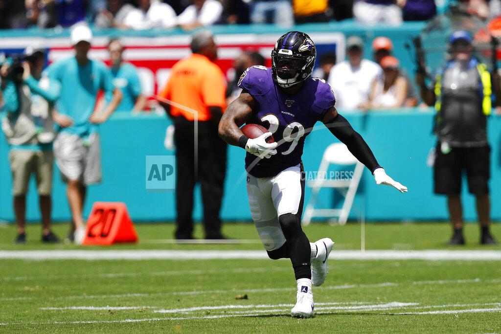 Brynn Anderson Baltimore Ravens free safety Earl Thomas (29) runs after intercepting a pass by Miami Dolphins quarterback Ryan Fitzpatrick , during the first half at an NFL football game, Sunday, Sept. 8, 2019, in Miami Gardens, Fla. (AP Photo/Brynn Anderson)