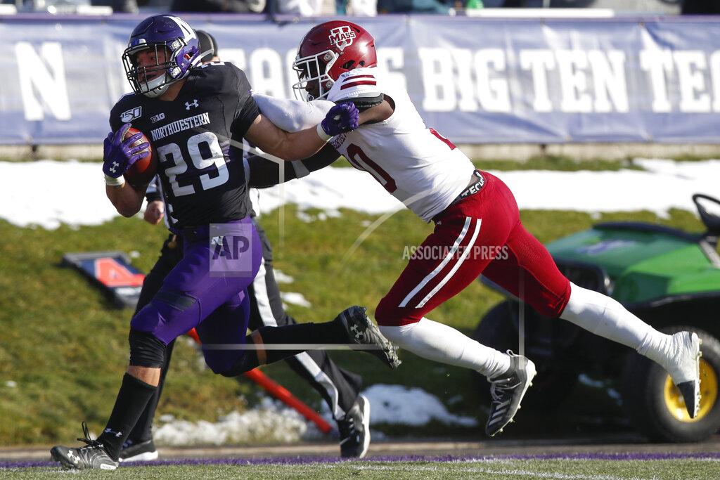 Jim Young Northwestern's Evan Hull, left, is hit by Massachusetts' Claudin Cherrelus on his way to scoring a touchdown during the second half of an NCAA college football game Saturday, Nov. 16, 2019, in Evanston, Ill. (AP Photo/Jim Young)