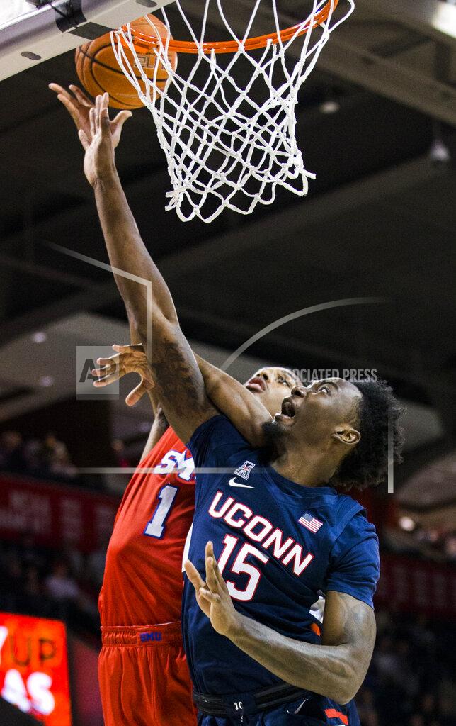 Ashley Landis SMU forward Feron Hunt (1) goes up for a shot while defended by Connecticut forward Sidney Wilson (15) during the first half of an NCAA college basketball game Wednesday, Feb. 12, 2020, in Dallas. (Ashley Landis/The Dallas Morning News via AP)
