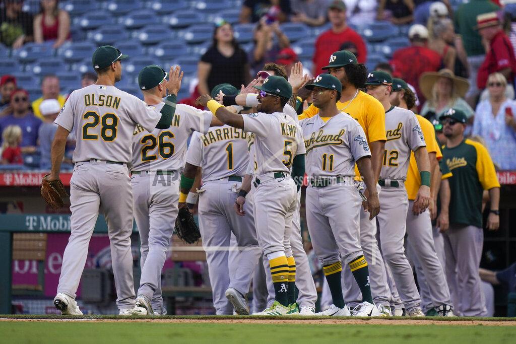 Jae C. Hong Oakland Athletics players celebrate a win over the Los Angeles Angels in a baseball game Sunday, Sept. 19, 2021, in Anaheim, Calif. (AP Photo/Jae C. Hong)