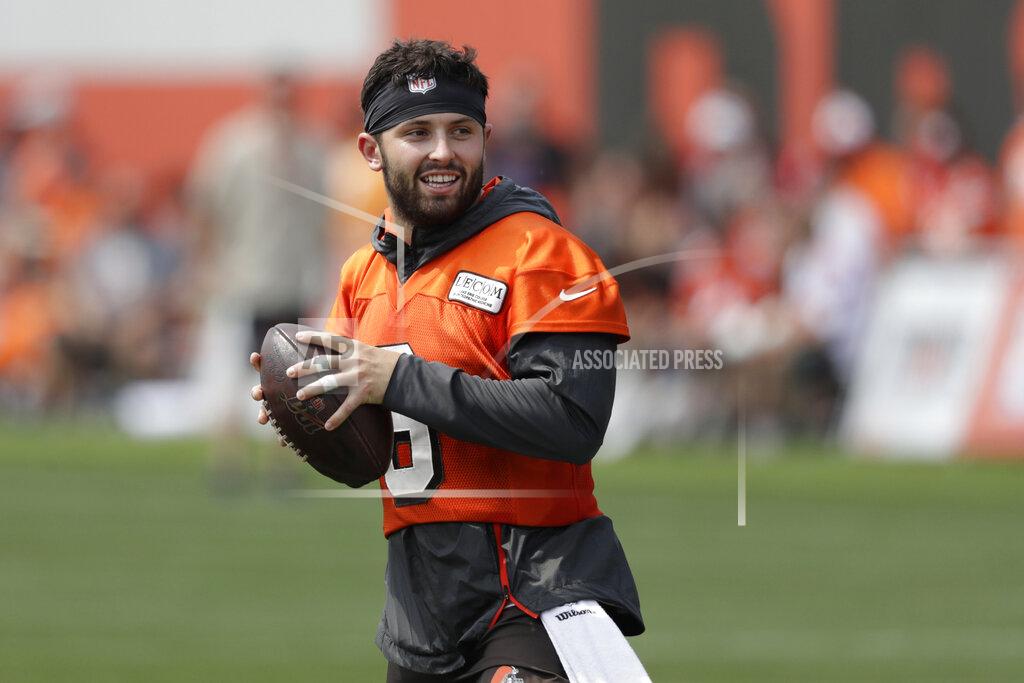 FILE - In this July 26, 2019, file photo, Cleveland Browns quarterback Baker Mayfield looks to throw during practice at the NFL football team's training camp facility in Berea, Ohio. The Browns’ star quarterback has added sports drink BODYARMOR to his growing list of endorsements. (AP Photo/Tony Dejak, File)
