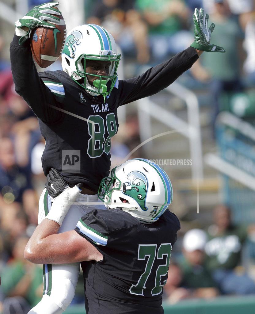David Grunfeld Tulane wide receiver Jabril Clewis (88) celebrates scoring a touchdown with offensive lineman John Leglue (72) during an NCAA college football game against Navy at Yulman Stadium in New Orleans, Saturday, Nov. 24, 2018. (David Grunfeld/The Times-Picayune via AP)