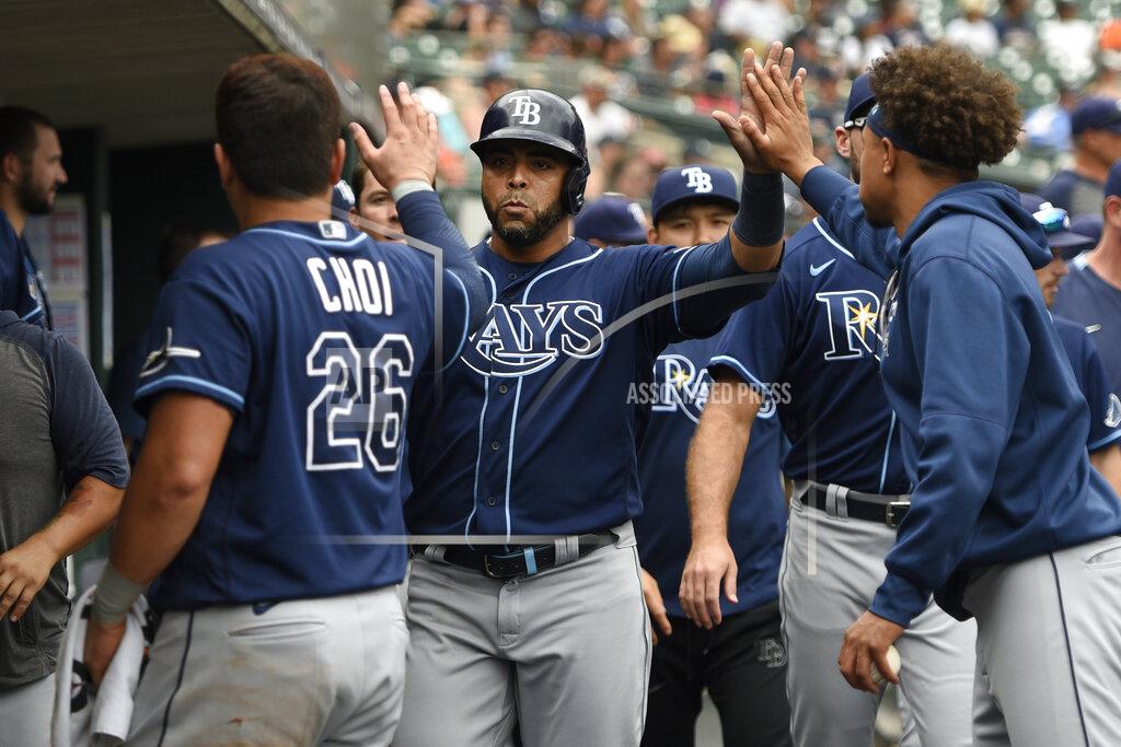 Jose Juarez Tampa Bay Rays designated hitter Nelson Cruz, center, is congratulated by teammates after scoring a run on a ground out by Kevin Kiermaier off Detroit Tigers relief pitcher Gregory Soto in the tenth inning of a baseball game, Sunday, Sept. 12, 2021, in Detroit. (AP Photo/Jose Juarez)