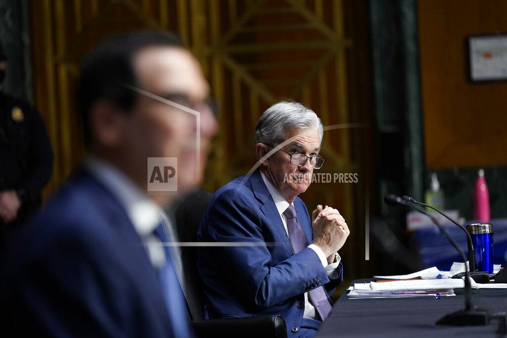 Susan Walsh Chairman of the Federal Reserve Jerome Powell and Treasury Secretary Steven Mnuchin testify during a Senate Banking Committee hearing on 'The Quarterly CARES Act Report to Congress' on Capitol Hill in Washington, Tuesday, Dec. 1, 2020. (AP Photo/Susan Walsh, Pool)