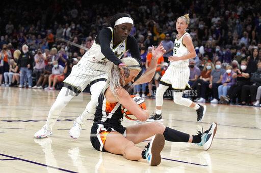 Chicago Sky forward Kahleah Copper (2) and Phoenix Mercury guard Sophie Cunningham (9) compete for a loose ball during the first half of Game 2 of basketball's WNBA Finals, Wednesday, Oct. 13, 2021, in Phoenix. (AP Photo/Rick Scuteri)