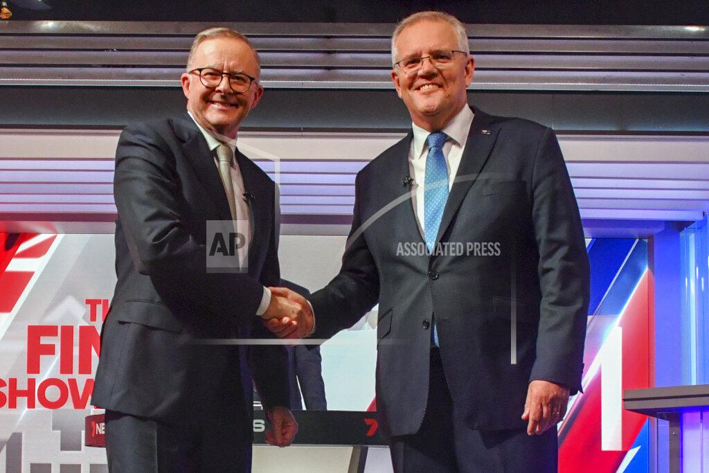 Mick Tsikas Australian Prime Minister Scott Morrison, right, and Australian opposition leader Anthony Albanese shake hands ahead of the leaders' debate in Sydney, Australia, on May 11, 2022. Australians go to the polls on Saturday, May 21, following a six-week election campaign that has focused on pandemic-fueled inflation, climate change and fears of a Chinese military outpost being established less than 2,000 kilometers (1,200 miles) off Australia’s shore.(Mick Tsikas/Pool Photo via AP)
