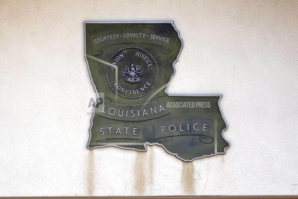 Rogelio V. Solis A Louisiana State Police sign hangs outside Louisiana State Police Troop F headquarters in Monroe, La., on Aug. 4, 2021. A seven-member panel had been focused on reviewing thousands of hours of body camera footage from about a dozen specific troopers in northern Louisiana’s Troop F, including some of those involved in the beatings of Greene and three other Black motorists. But according to several people familiar with the matter who spoke to AP on condition of anonymity, the panel was abruptly disbanded in July after just a few months' work following leaks about its existence. (AP Photo/Rogelio V. Solis)