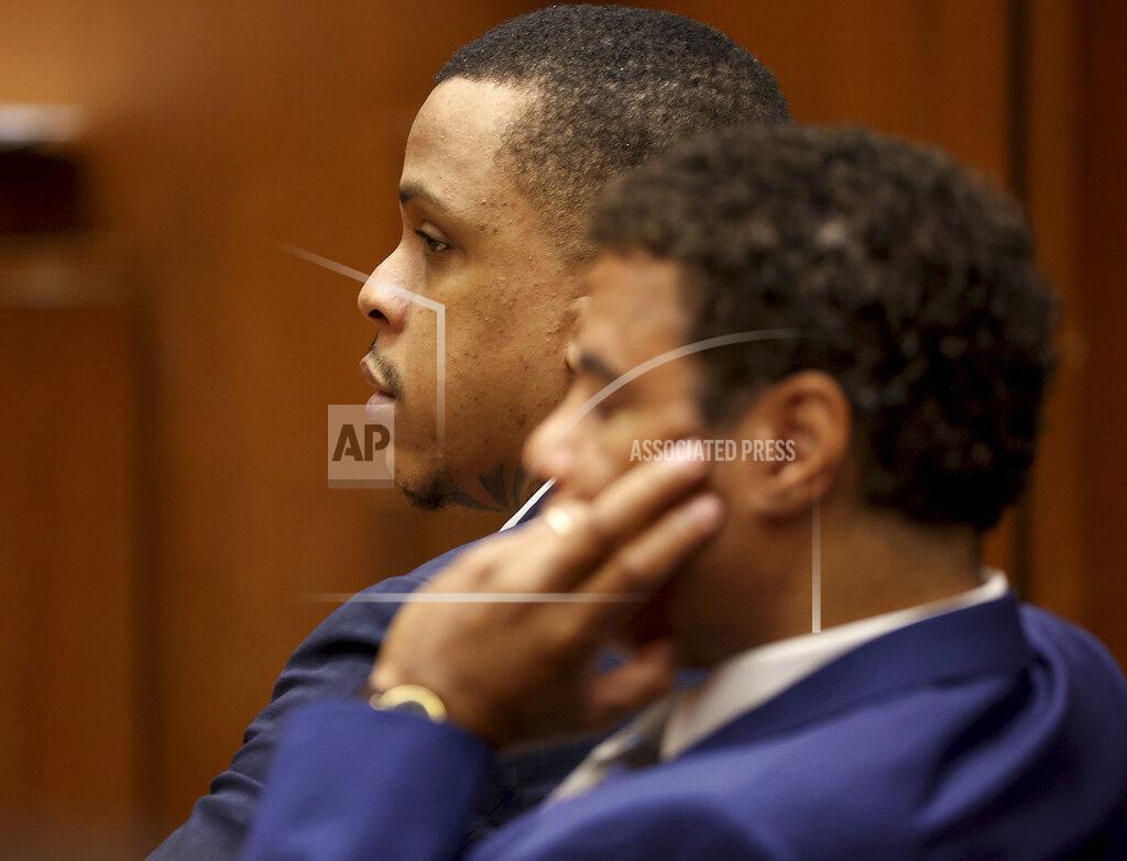 Frederick M. Brown Defendant Eric Holder and his attorney Aaron Jansen, right, listen during opening statements in Holder's murder trial, Wednesday, June 15, 2022, at Los Angeles Superior Court in Los Angeles. Holder, 32, faces one count of first degree-murder and two counts of attempted first-degree murder for the killing the Grammy Award-winning rapper Nipsey Hussle outside his clothing store three years ago. (Frederick M. Brown/Daily Mail.com via AP, Pool)