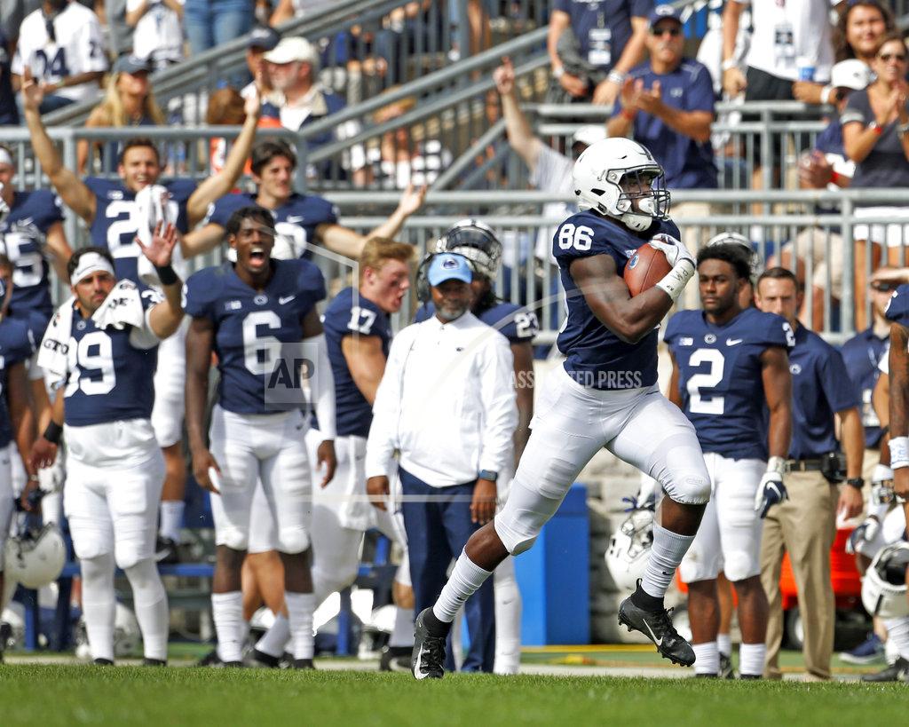 Chris Knight FILE- In this Saturday, Sept. 15, 2018, file photo, Penn State's Daniel George (86) heads to the endzone on for a 95-yards touchdown reception against Kent State during the second half of an NCAA college football game in State College, Pa. Traditional Big Ten powers Wisconsin, Michigan and Michigan State have lost out-of-conference games. There are only five unbeaten teams remaining in the conference, and that number seriously might be down to one at the end of the month after No. 4 Ohio State plays at No. 10 Penn State. Slow starts, however, doesn’t mean the conference is out of the national title hunt. (AP Photo/Chris Knight, File)