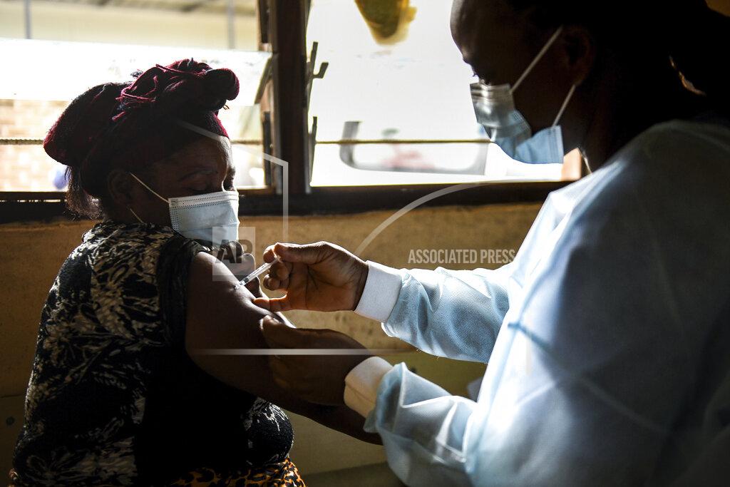 Thoko Chikondi A woman receives an AstraZeneca COVID-19 vaccine at Ndirande Health Centre in Blantyre Malawi, Monday, March 29, 2021. Malawi is vaccinating health care workers, elderly and those with health conditions that put them at higher risk of severe COVID-19, using the AstraZeneca doses that arrived early in March. (AP Photo/Thoko Chikondi)