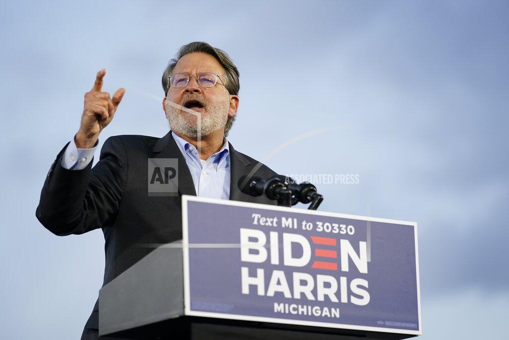 Sen. Gary Peters, D-Mich., speaks during an event for Democratic presidential candidate former Vice President Joe Biden at Michigan State Fairgrounds in Novi, Mich., Friday, Oct. 16, 2020. (AP Photo/Carolyn Kaster)