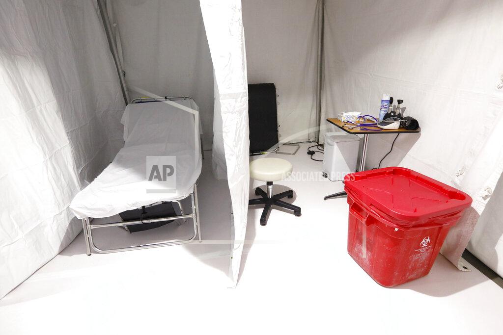 Rogelio V. Solis This is one of the 24 bays that are spaced out and separated from the others in the basement of a parking structure on the campus of the University of Mississippi Medical Center in Jackson, Miss., Wednesday, April 8, 2020. The mobile field clinic was built in anticipation of more coronavirus cases. (AP Photo/Rogelio V. Solis)