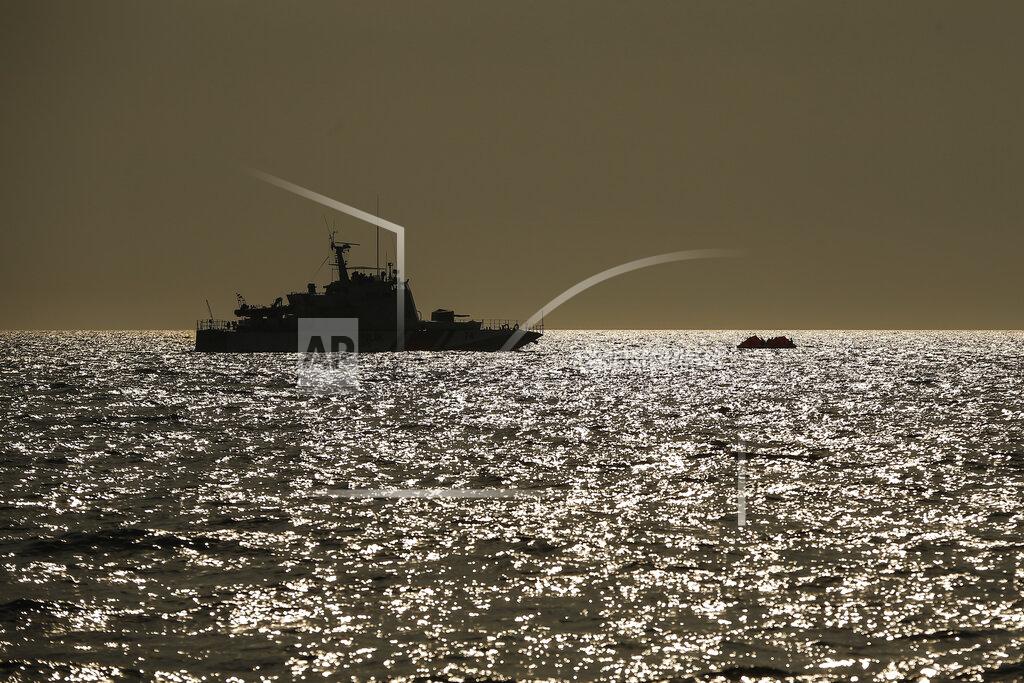 Emrah Gurel A Turkish coast guard vessel approaches a life raft with migrants in the Aegean Sea, between Turkey and Greece, Saturday, Sept. 12, 2020. Turkey is accusing Greece of large-scale pushbacks at sea — summary deportations without access to asylum procedures, in violation of international law. The Turkish coast guard says it rescued over 300 migrants "pushed back by Greek elements to Turkish waters" this month alone. Greece denies the allegations and accuses Ankara of weaponizing migrants.(AP Photo/Emrah Gurel)