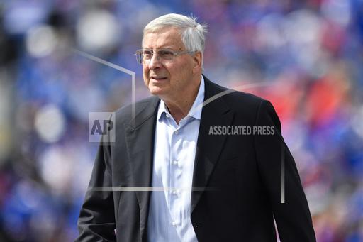FILE - Buffalo Bills co-owner Terry Pegula walks on the field before the team's NFL football game in Orchard Park, N.Y., Sept. 17, 2023. John Roth, the newly appointed chief operating officer of the Bills and the NHL's Buffalo Sabres, was fired Wednesday along with the Bills' general counsel, Kathryn D&rsquo;Angelo, because the two were in a romantic relationship, a person briefed on the matter told The Associated Press. Roth had been appointed COO of the Bills in July following a management shakeup involving both teams, which are owned by Terry and Kim Pegula. In a joint telephone interview with The AP, Roth and D'Angelo confirmed they were dismissed without going into detail. (AP Photo/Adrian Kraus, File)